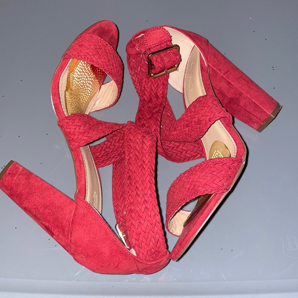 Red woman’s heel worn once.